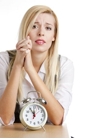 portrait of businesswoman with an alarm clockの写真素材