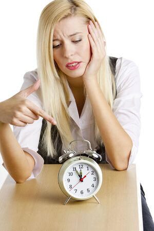 portrait of businesswoman with an alarm clockの写真素材