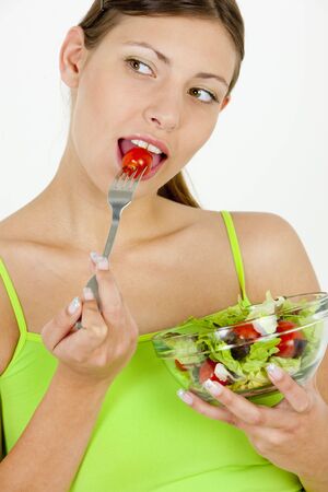 portrait of woman eating saladの写真素材