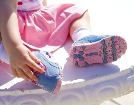 detail of little girl wearing shoes
