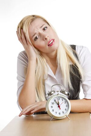 portrait of businesswoman with an alarm clockの写真素材