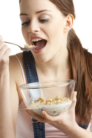 portrait of woman eating cerealsの写真素材