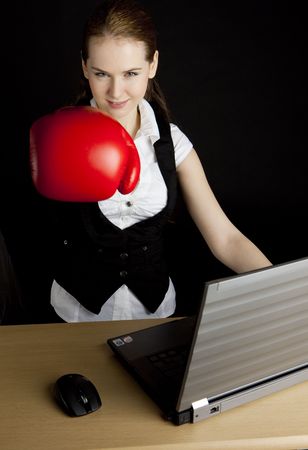 businesswoman with a notebook and boxing gloveの写真素材