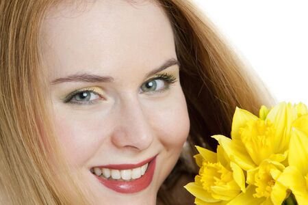 portrait of woman with daffodilsの写真素材