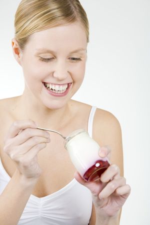 woman eating yogurtの写真素材