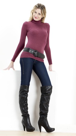 standing woman wearing fashionable bootsの写真素材