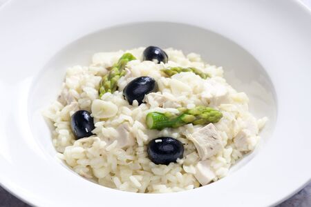 chicken rissoto with asparagus and olivesの写真素材