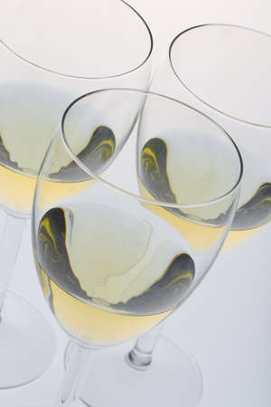 wineglasses with white wineの写真素材