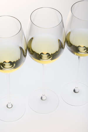 wineglasses with white wineの写真素材