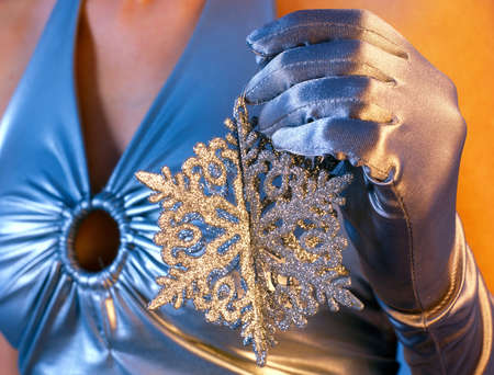 woman holding snowflakeの写真素材