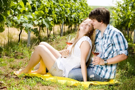 couple at a picnic in vineyardの写真素材