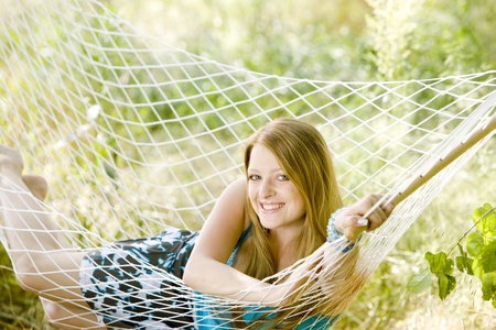 woman resting in hammockの写真素材