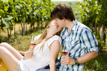 couple at a picnic in vineyardの写真素材