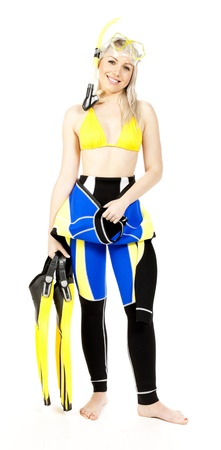 standing young woman wearing neoprene with snorkeling equipmentの写真素材