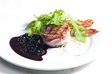 beefsteak grilled in bacon with sauce of juniper and red wineの写真素材