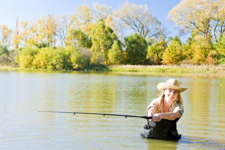 woman fishing in pond