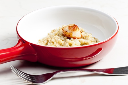 fried Saint Jacques mollusc with pearl barley risottoの写真素材