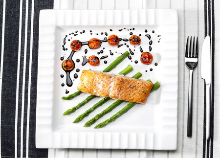 baked salmon with green asparagus and cherry tomatoesの写真素材