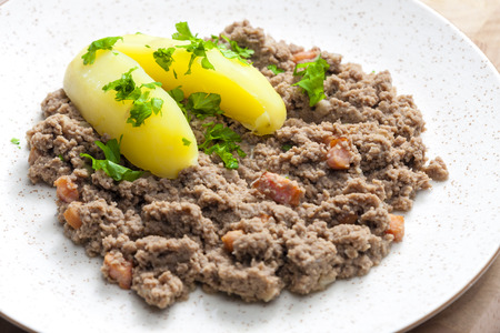 hash meat with bacon and potatoesの写真素材