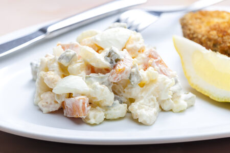 fried carp with potato saladの写真素材