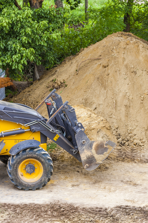 excavator at construction siteの写真素材
