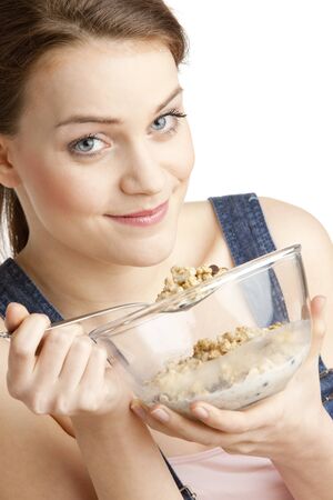 portrait of woman eating cerealsの写真素材