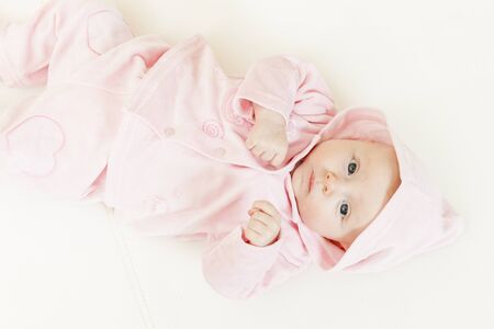 lying three months old baby girlの写真素材