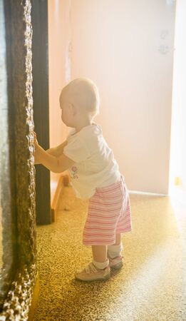 standing toddler in a room