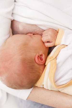 portrait of mother nursing her babyの写真素材