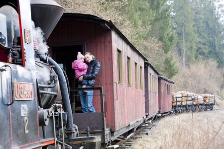 mother with her daughter traveling by train, Ciernohronska Railway, Slovakiaの写真素材