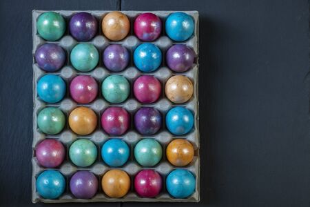 Easter background with hand painted purple, blue, green, orangeの写真素材