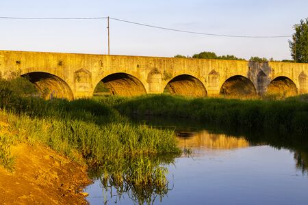 Old stone bridge over Vitek pond near Trebon, Southern Bohemia, Czech Republic