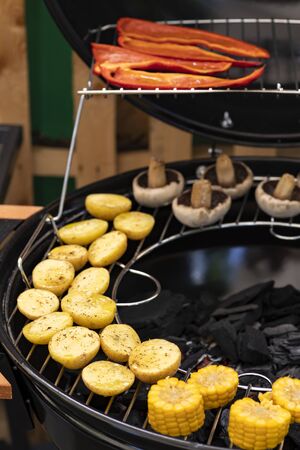 grill with potatoes, turkey meat, zucchini, mushrooms and sausages