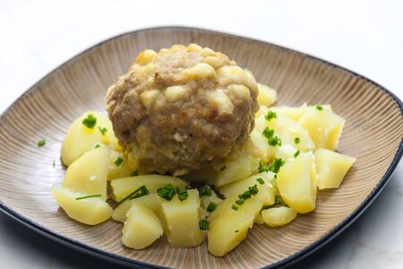 meat ball baked with beans and cheese served with potatoesの写真素材