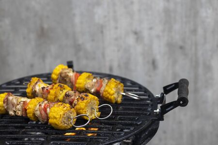 chicken skewer with corn and red pepperの写真素材