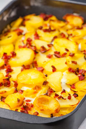 still life of baked potatoes with baconの写真素材