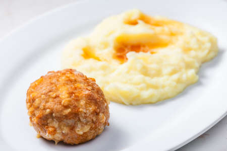 meat ball with cheese served with mashed potatoesの写真素材