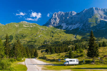 Caravan in summer mountain landscape, Alps, Italyのeditorial素材