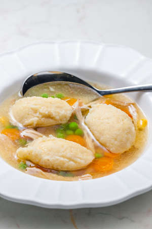 chicken broth with semolina dumplings and vegetablesの写真素材