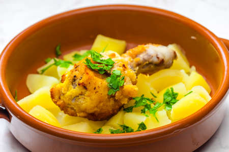 fried chicken leg with potatoesの写真素材