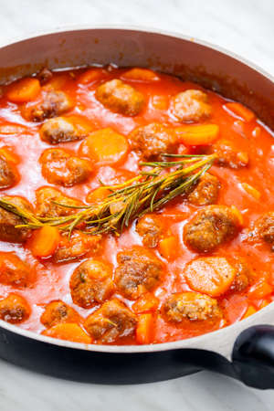 meat balls in tomato sauce with carrotの写真素材