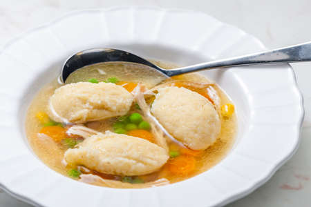 chicken broth with semolina dumplings and vegetablesの写真素材