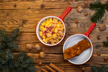 Traditional Christmas dinner in Czech Republic - carp fillet with potato saladの写真素材