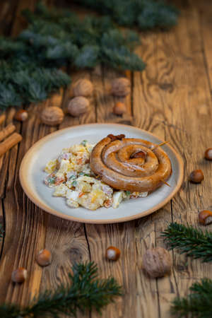 Traditional Christmas food in Czech Republic - white sausage with potato saladの写真素材