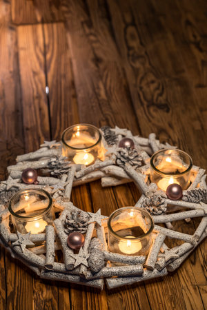 white advent christmas wreath with candlesの写真素材