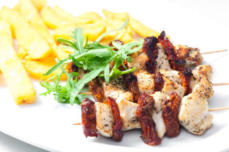 skewers with dry tomatoes and poultry meatの写真素材