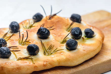 foccacia with black olives and rosemaryの写真素材