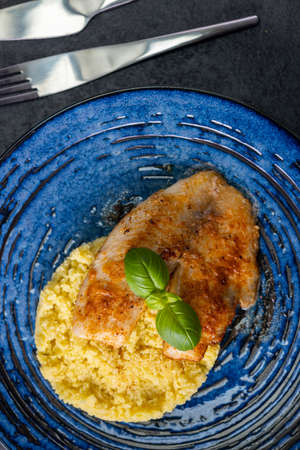 spicy fillet of white cod with couscousの写真素材