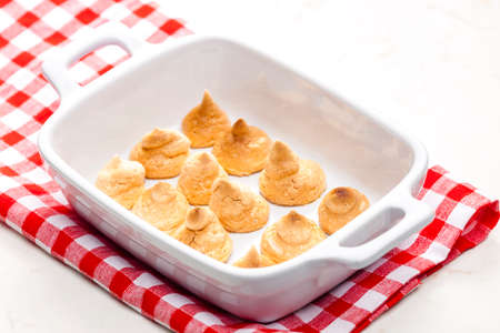 coconut meringues in baking plateの写真素材