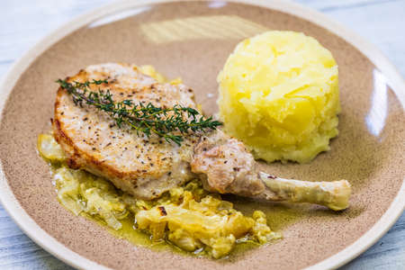 pork chop with thyme baked on creamy onion with mashed potatoesの写真素材